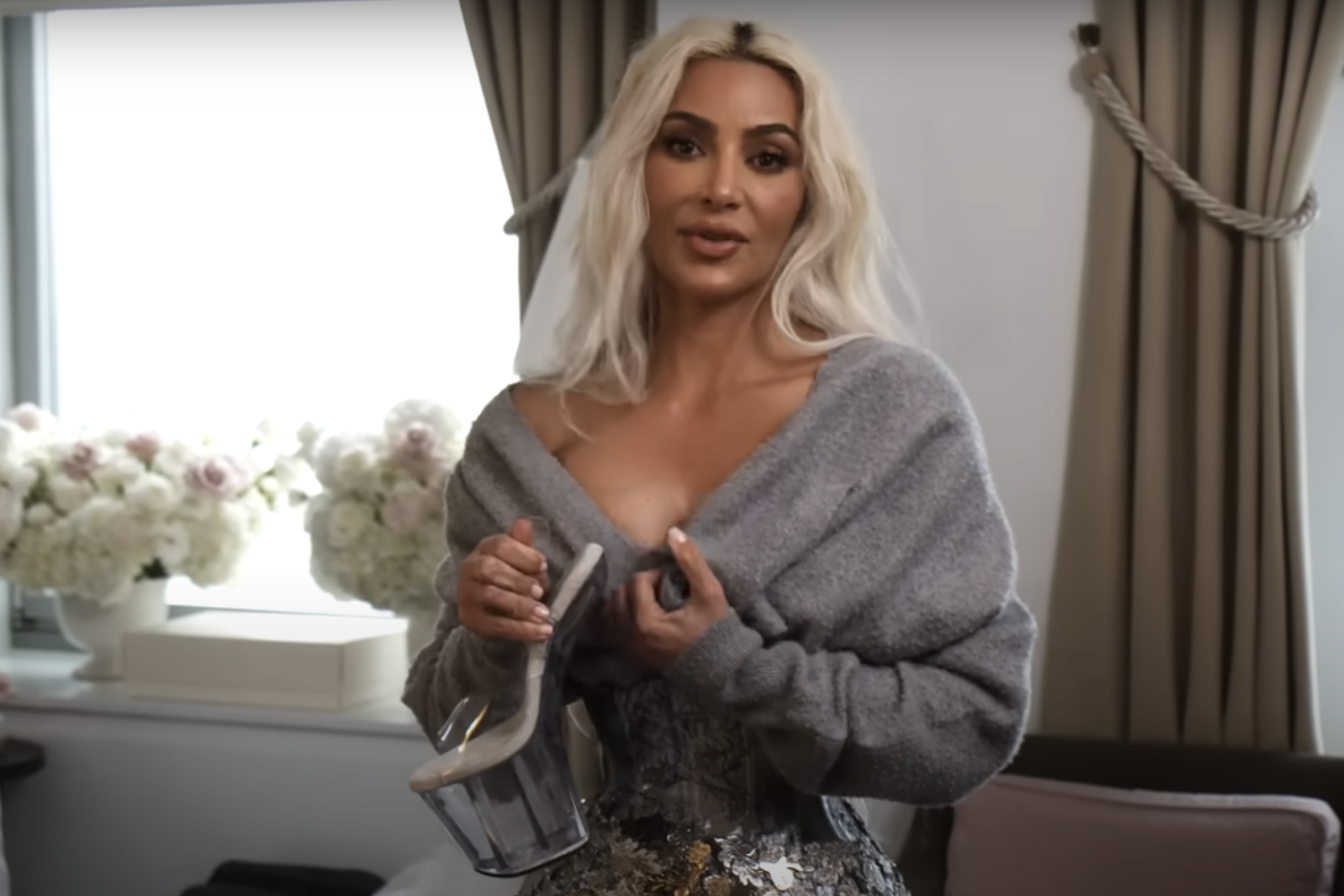 Kim Kardashian Explains Why She Was Awkwardly Holding Sweater Over Her Chest at The Met Gala